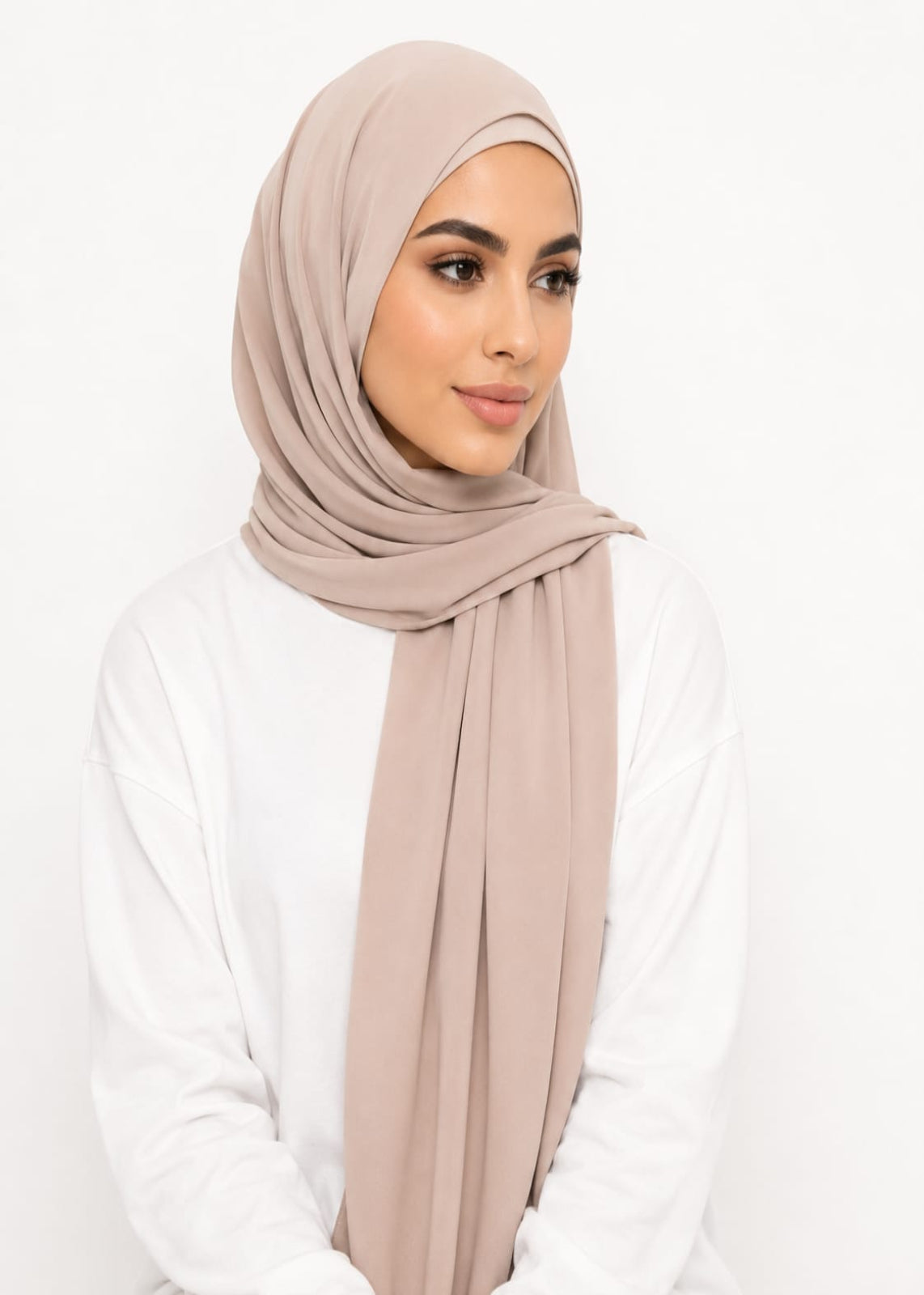 Woman wearing a beige liquid jersey hijab
