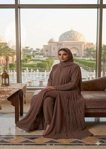 Woman in a brown outfit sitting in a room with a view of a famous landmark.